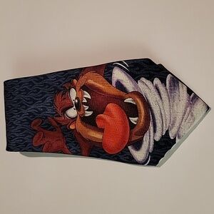 LOONEY TUNES TAZ NECK TIE IN A BLACK AND BLUE PATTERN